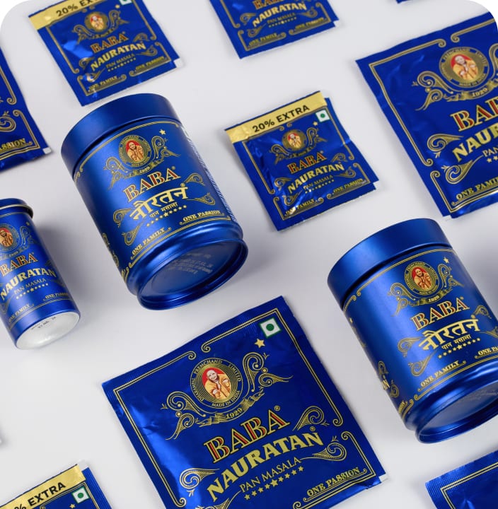 Baba Nauratan pan masala tins and sachets in deep blue, laid out flat